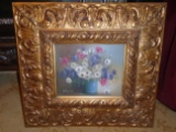 Oil Painting in a gold frame, depicts flowers in a pot