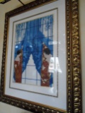 Framed Lithograph in a gold frame. Depicts twin women looking out the window.