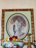 Wall art in a frame. Depicts 2 women reading a book.  Hand signed by the artist Louis Icart.
