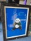 Framed wall art, depicts a panda with blue background.