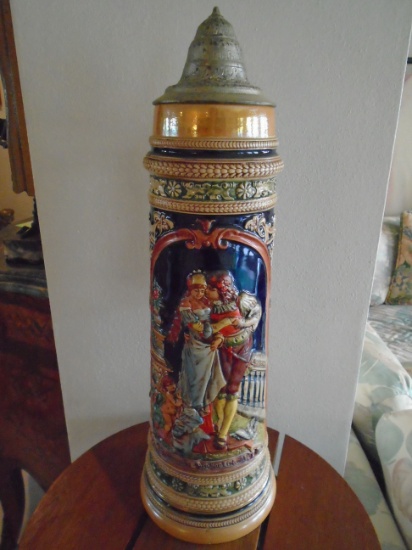 Large beer stein depicting a loving couple.