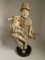 Carved and etched hippo ivory Sculpture of man holding a stick with baskets & fish.