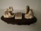 Carved and etched hippo ivory Sculpture of 2 children playing with masks.