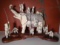 Carved and etched hippo ivory Sculptures of an elephant & 11 figures.