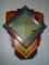 Wall hung mirror with wood frame.