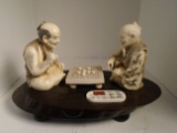 Carved and etched hippo ivory Sculpture of 2 men playing a game