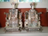 Pair of Carved and etched hippo ivory Sculptures of and emporer & emporess sitting in chairs.