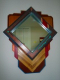Wall hung mirror with wood frame.