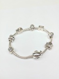 This Lot is for a Pre-Owned Womens Pandora Silver & 925 it has 7 Charms.