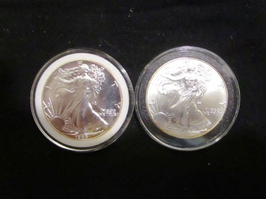 2 American Silver Eagles, 1988 & 2001, in capsules