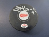 Steve Yzerman of the Detroit Red Wings signed autographed logo hockey puck PAAS COA 907