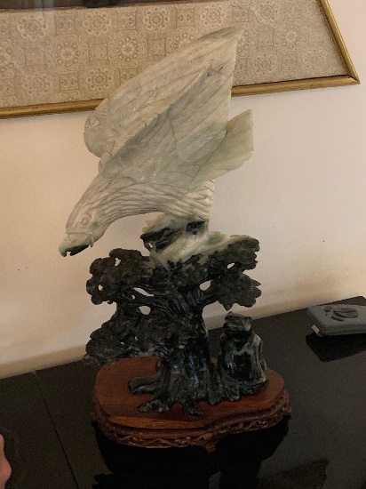 Jadite Eagle standing above bear with wood stand
