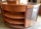 Two piece Rounded Cash Register merchandising Stand with three wood Shelves in one unit and three ro