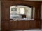 10ft Custom Made Wood Wall Unit with (8) Storage Cabinets Mirrored Back and Illuminated Bridge. The