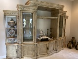11Ft Wall Unit with Rounded Glass Doors, Illuminated Bridge and (2) Shelving Units. The piece comes