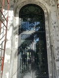 114â€œH Impact Front Door With Ornate Wrought-Iron Workings, Large Glass Panels With Iron Pulls, Bra