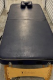 Master Portable Massage Table with Light colored Wood Frame and 4