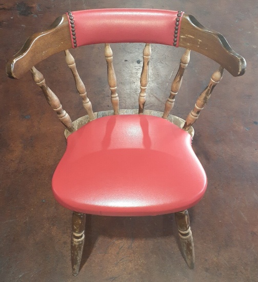 Wooden chair with red cushions