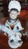 Monkey Dress as a lady reading a book in Porcelain- 11 in.