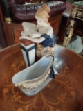 Woman reading a book in Porcelain - 11 in.