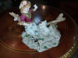 Girl playing with cat in Porcelain