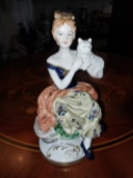 Girl sitting holding a cat in porcelain - 7.5 inches