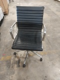 Black leather office chairs with casters
