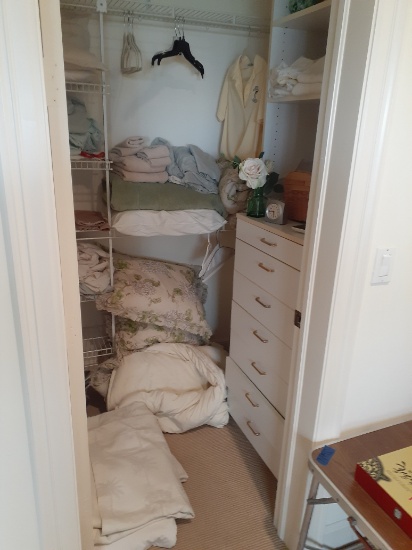 Closet of contents - towels, bedspread - no racks