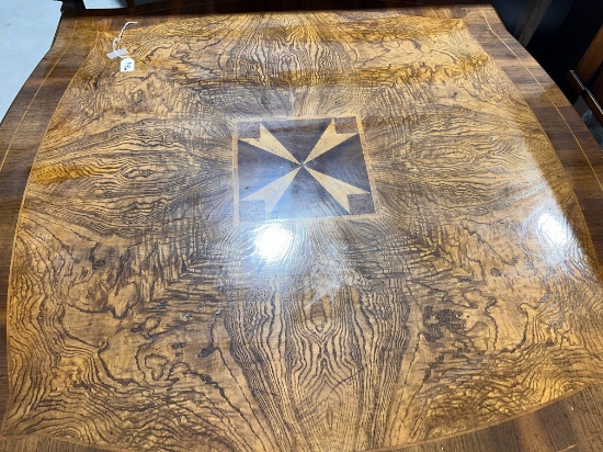 Walnut coffee table with carved legs and pull out legs and inlay in the center, 48" X 48"