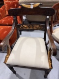 Empire armchair with carved gold details. Upholstery in Muslin