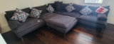 Modern L Shaped sectional sofa with ottoman and pillows