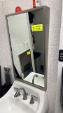 Handicapped bathroom mirror