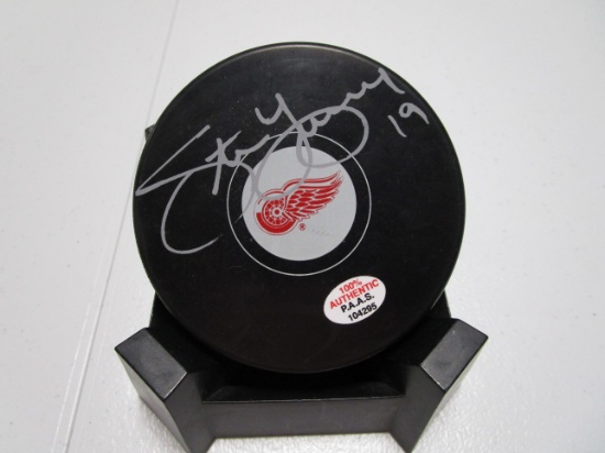 Steve Yzerman of the Detroit Red Wings signed autographed logo hockey puck PAAS COA 295
