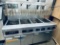 Frymaster model FPPH455 natural gas four pot fryer with built-in filtration system mounted on caster