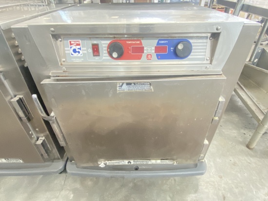 Metro C5  heated holding cabinet on casters comes with three stainless steel racks and features temp