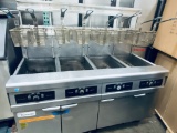Frymaster model FPPH455 natural gas four pot fryer with built-in filtration system mounted on caster