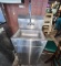 Stainless steel sink with towel and soap dispenser