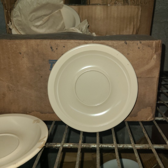 Coffee cup saucers, cream
