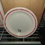 Round speckled plate with red rim
