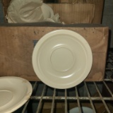 Coffee cup saucers, cream