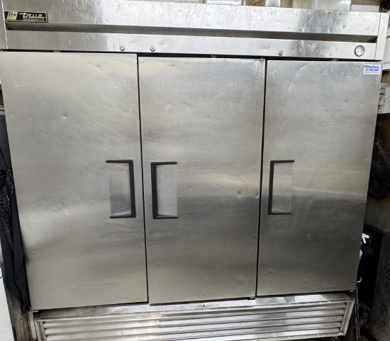 True model T-72  three door stainless steel refrigerator with (12) epoxy coated adjustable shelves.