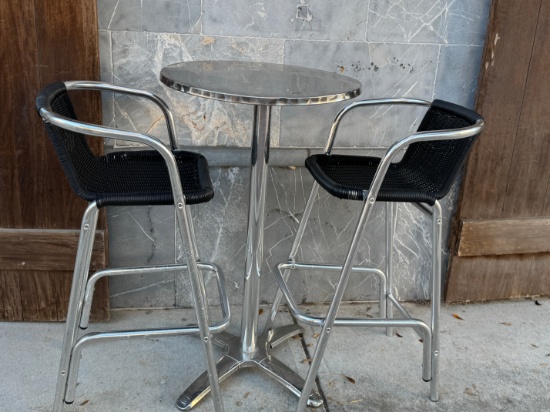 Brushes Stainless Steel outdoor high top table set with (2) Rattan Cushioned Bar Stools