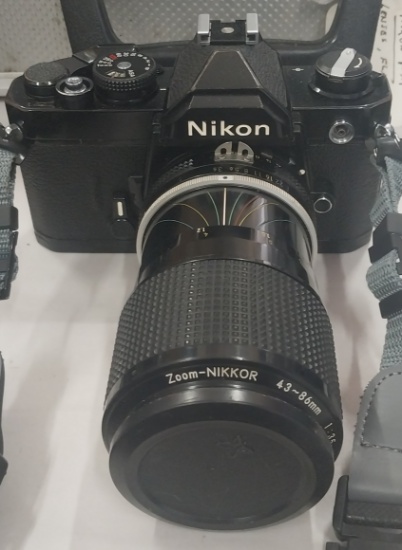 Nikon FM 35mm SLR Camera with Three Lenses, Vivitar Flash and Aluminum Case