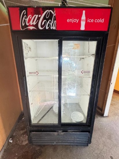 True GDM 37 two slide door merchandising cooler works good. Need some TLC