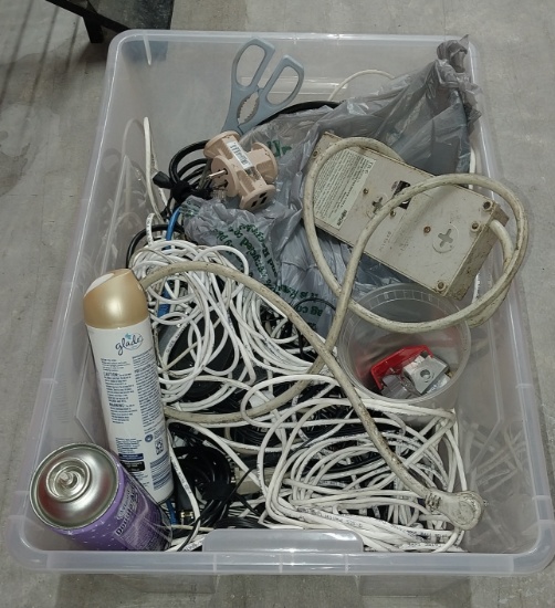 Box of misc. surge protectors and cords and more with Plastic bin