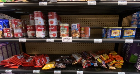 2 shelfs of assorted canned Foods & Candy