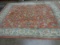 ORIENTAL  STYLE RUG: ROSE GROUND WITH GRAPE AND LEAF DESIGN (7' X 10')