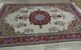 WOOL ON COTTON  ORIENTAL RUG WITH CREAM GROUND, RED CENTER MEDALLION AND BORDER MADE IN ISPARTA (7'X