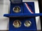 (2) 1986 U.S MINT LIBERTY COIN SETS: (1) UNCIRCULATED LIBERTY DOLLAR SILVER COIN; (1) TWO-COIN PROOF