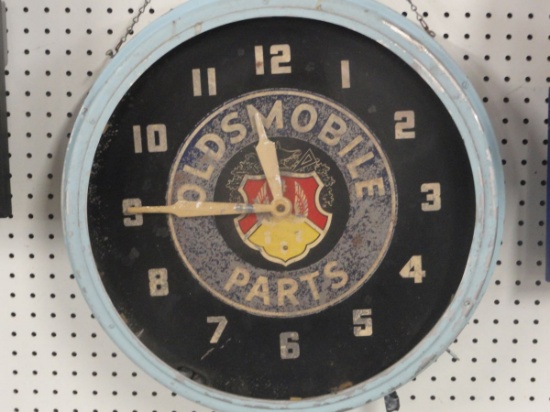 VINTAGE ROUND OLDSMOBILE PARTS LIGHTED CLOCK- 19" DIAMETER